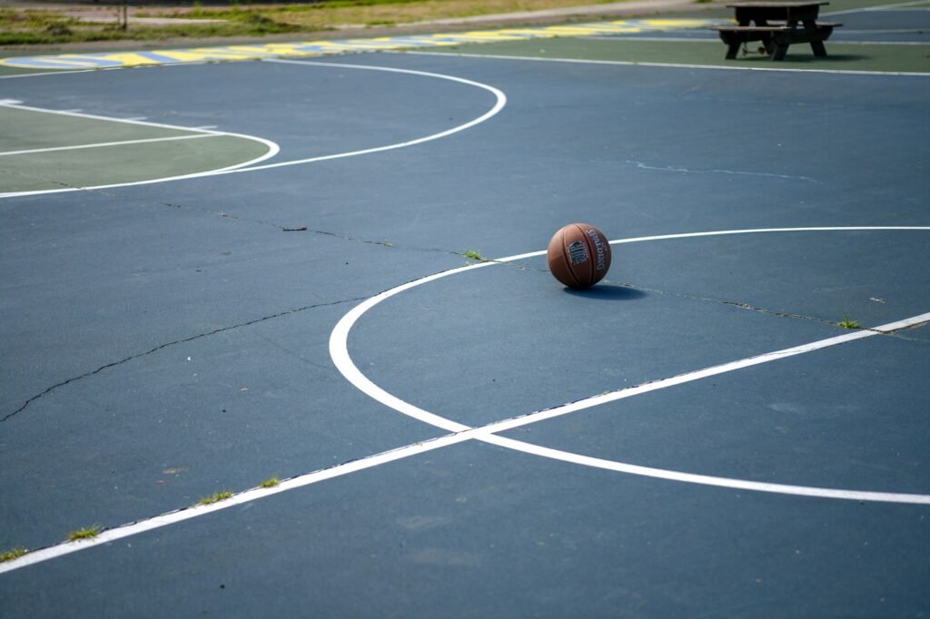 Basketball resting on an outdoor court